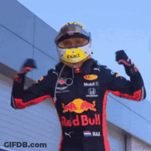 Man In Red Bull Racing Suit Flexing Muscles GIF