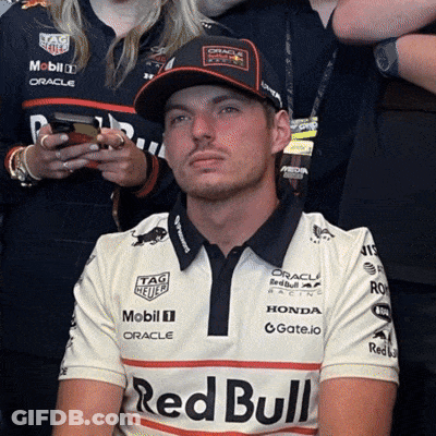Man In Red Bull Shirt And Baseball Cap GIF