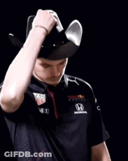 Man In Red Bull Shirt Holding Steering Wheel Over Face GIF