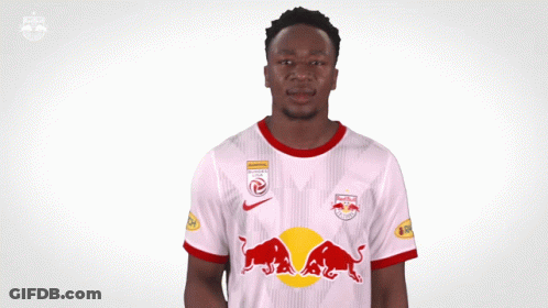 Man In Red Bull Shirt Pointing To Chest GIF