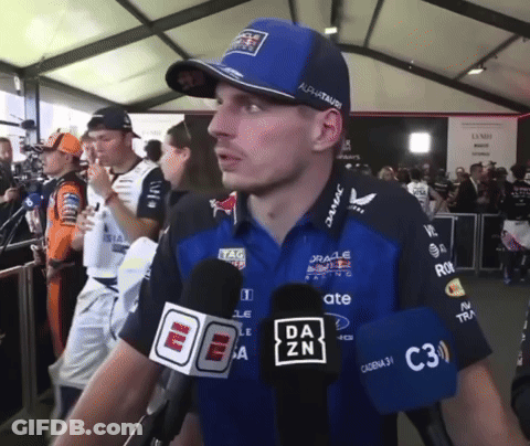 Man In Red Bull Shirt Talking Into Microphone GIF