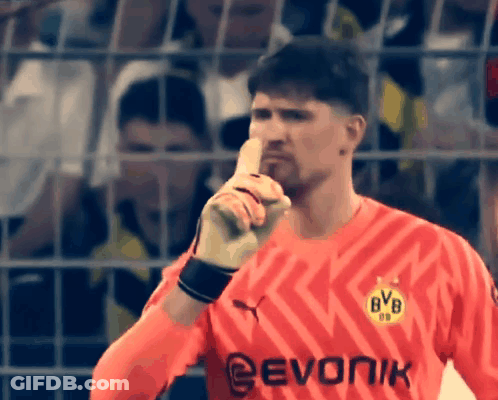 Man In Red BVB Jersey With Finger To Mouth GIF
