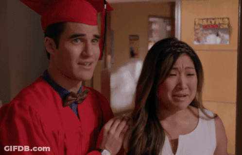 Man In Red Cap And Gown Beside Crying Woman GIF