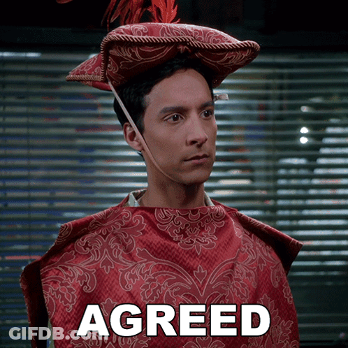 Man In Red Cape And Hat Saying Agreed GIF