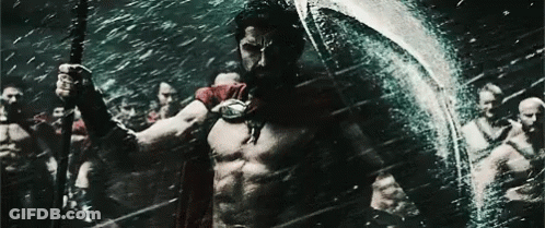 Man In Red Cape Holding Spear And Shield GIF