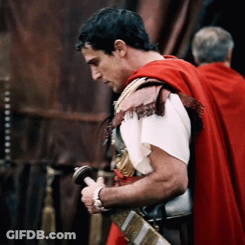 Man In Red Cape Holding Sword GIF