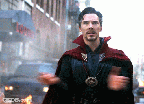 Man In Red Cape In Front Of Lounge Building GIF