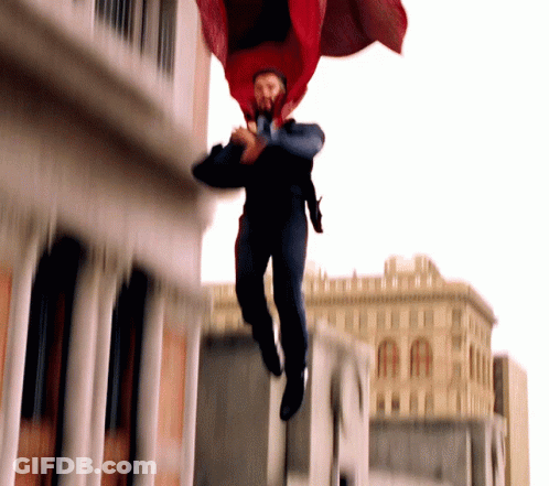 Man In Red Cape Jumping GIF