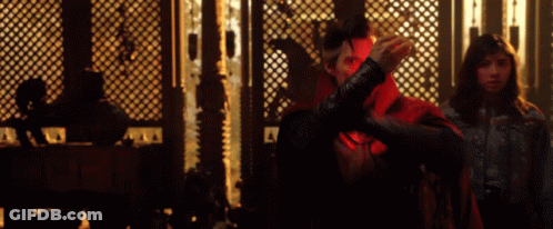 Man In Red Cape Next To Woman GIF