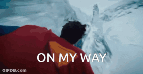 Man In Red Cape Walking In Snow Saying On My Way GIF