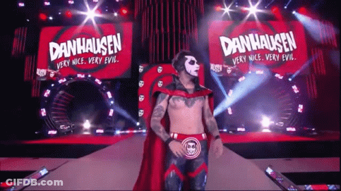 Man In Red Cape Walking Stage Danhausen Banner GIF