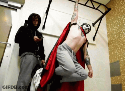 Man In Red Cape With Number 8 On Face GIF