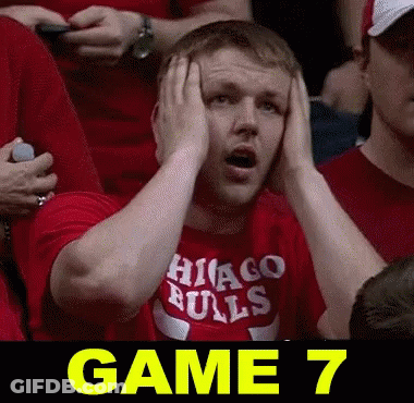Man In Red Chicago Bulls Shirt Holds Head GIF