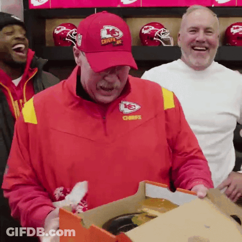 Man In Red Chiefs Jacket Holding Box GIF