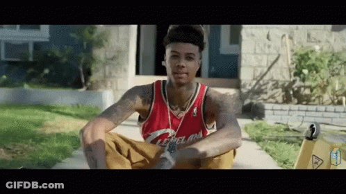 Man In Red Cleveland Jersey Sitting On Sidewalk GIF