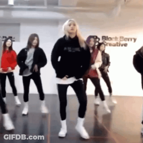 Man In Red Coat Dancing By Verizon Banner GIF