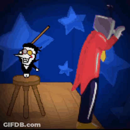 Man In Red Coat Next To Stool And Cartoon Character GIF