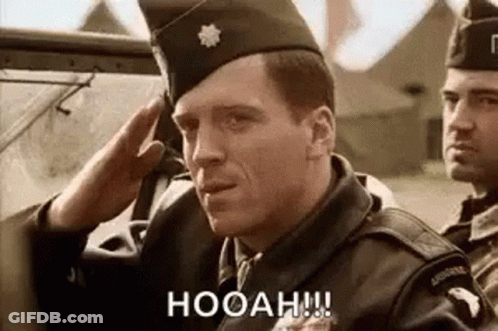 Man In Red Coat Saluting With Shotgun GIF