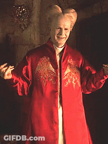 Man In Red Coat With Dragon GIF