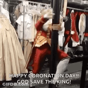 Man In Red Costume Holding Sword By Pole GIF