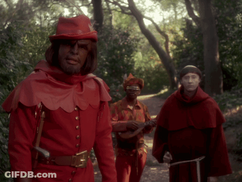 Man In Red Costume Playing Guitar GIF