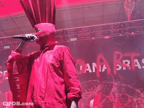 Man In Red Costume Singing Into Microphone Ana Bras GIF