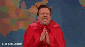 Man In Red Devil Costume Praying GIF