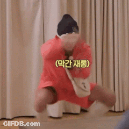 Man In Red Dress And Hat Jumping GIF
