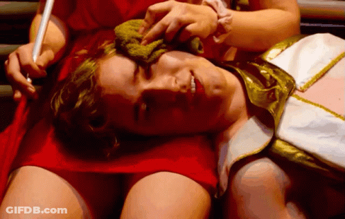 Man In Red Dress Laying On Woman's Lap GIF
