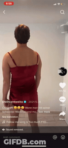 Man In Red Dress Standing In Front Of Wall GIF