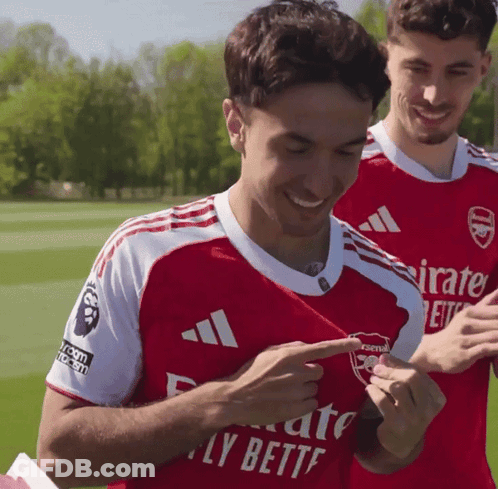 Man In Red Emirates Fly Better Jersey GIF