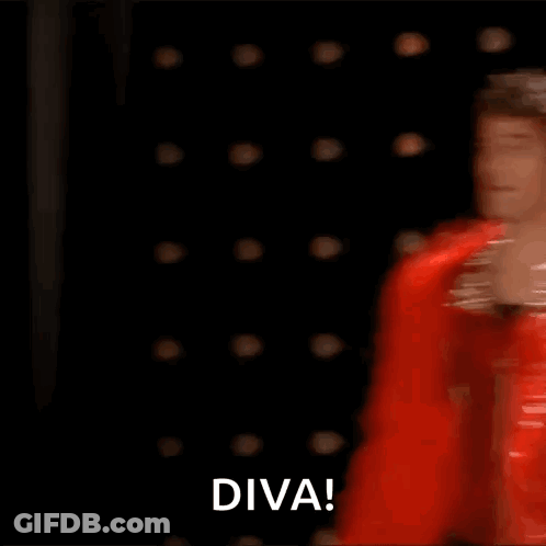 Man In Red Feather Boa Dancing On Stage Saying Diva GIF