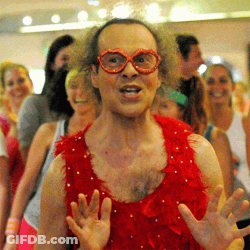 Man In Red Feathers And Glasses GIF