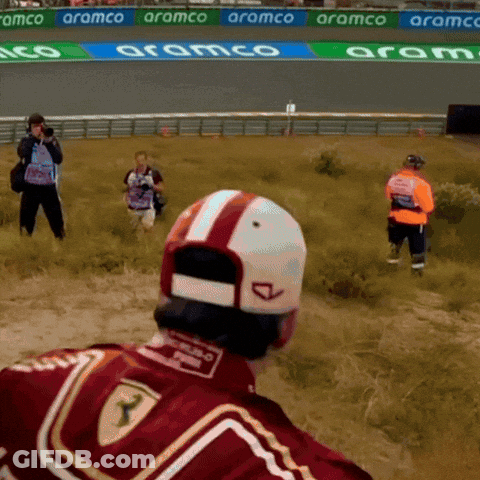Man In Red Ferrari Jacket In Field GIF