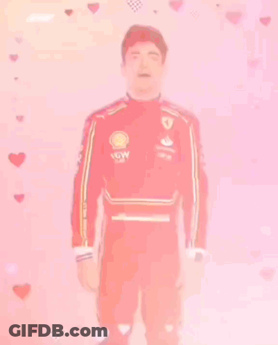 Man In Red Ferrari Suit With Hearts GIF