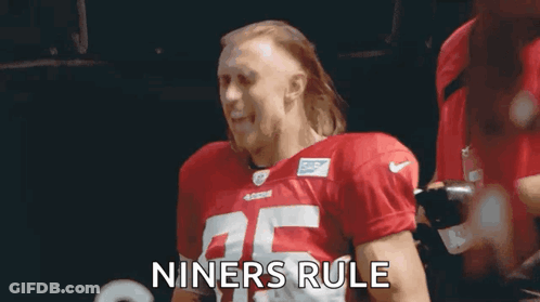 Man In Red Football Jersey Holding Chest GIF