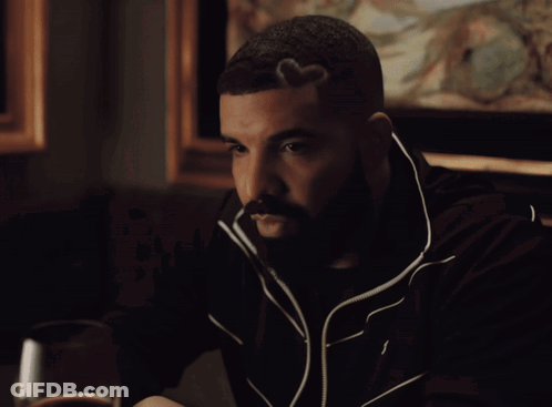Man In Red Fur Coat Sitting In Stadium GIF