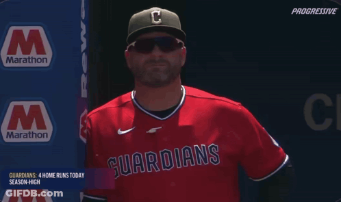 Man In Red Guardians Jersey With Marathon Sign GIF
