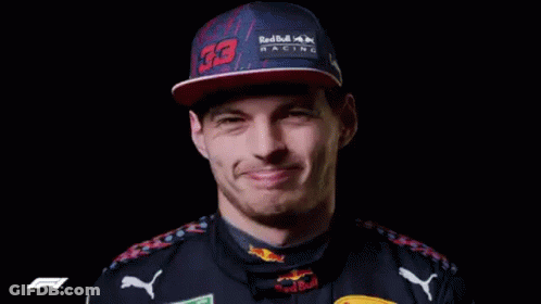 Man In Red Hat And Black Shirt Smiling GIF