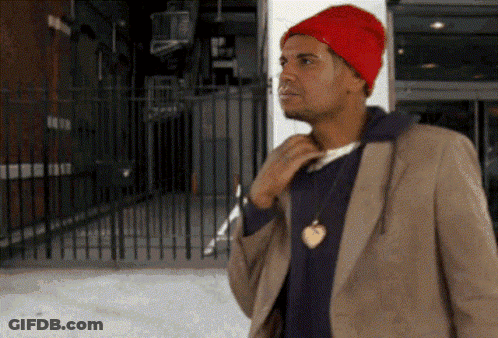 Man In Red Hat And Brown Jacket At Fence GIF