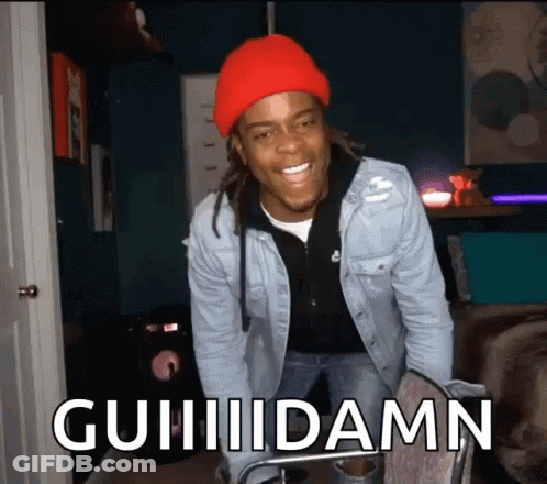 Man In Red Hat And Denim Jacket Saying Guiiidamn GIF