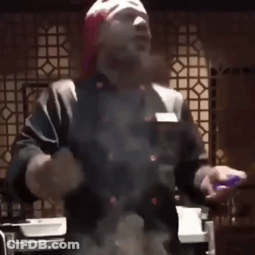 Man In Red Hat And Gloves Cooking GIF