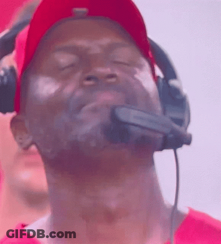 Man In Red Hat And Headphones Looking Up GIF
