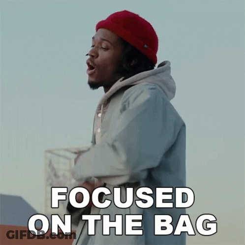 Man In Red Hat And Hoodie Focused On Bag GIF