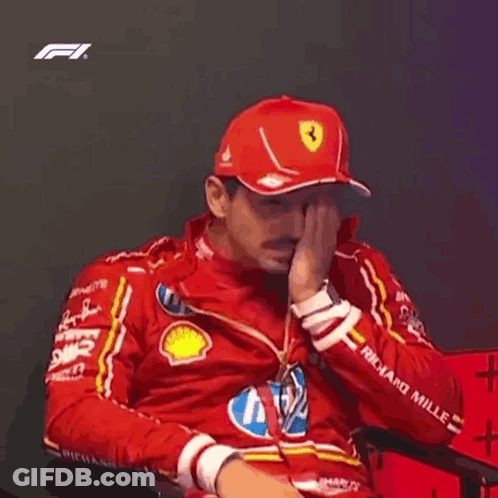 Man In Red Hat And Jacket Sitting GIF