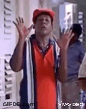 Man In Red Hat And Shirt Making Funny Face GIF