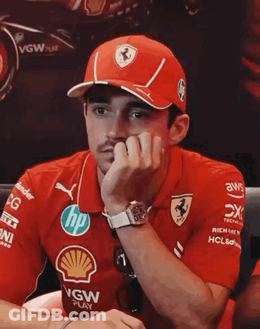 Man In Red Hat And Shirt Sitting GIF