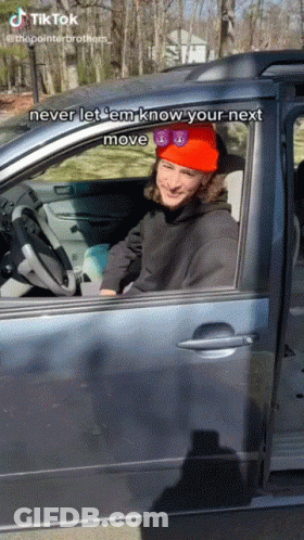 Man In Red Hat And Sunglasses Driving Car GIF