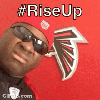 Man In Red Hat And Sunglasses In Front Of Falcons Logo GIF