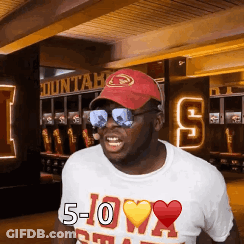Man In Red Hat And Sunglasses Wearing 5-0 Shirt GIF
